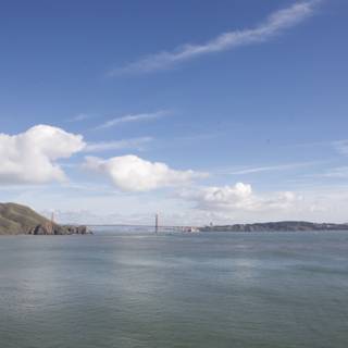 The Golden Gate Bridge shining under the bright blue sky