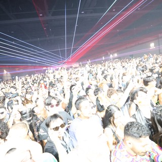 Massive Crowd Surges Under Laser Light Show