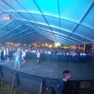 Nighttime Concert Crowd in a Tent