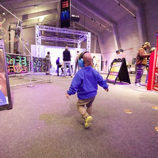 Child Running Through Interactive Museum Exhibition Space