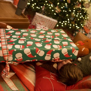 Christmas Morning Gift Opening with Illuminated Tree