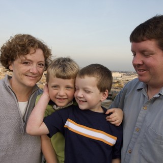 Family Portrait on Urban Rooftop at Dusk