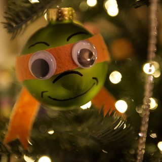 Festive Green Christmas Ornament with Orange Scarf