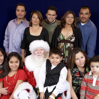 A Happy Family with Santa Claus at APC Christmas Party