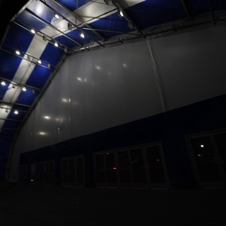 Blue and White Venue Stage Wall at Night