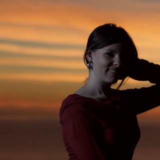 Silhouette Portrait Against a Fiery Sunset Sky