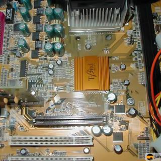 Yellow and Black Chip on Computer Motherboard