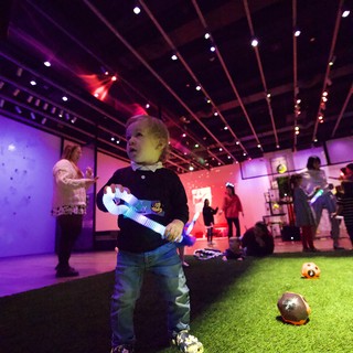 Child Plays with Light Toy at Asian Art Museum Baby Rave