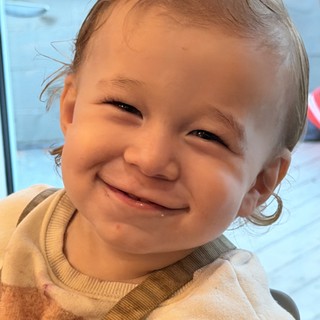 Joyful Toddler Portrait with Beaming Smile