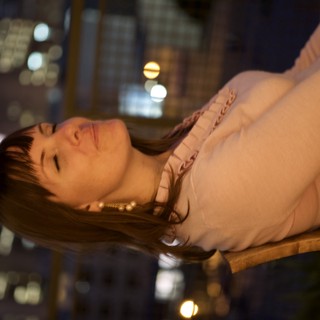 Serene Night Portrait Among City Lights