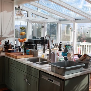 Busy Christmas Kitchen with Sun-Filled Greenhouse View