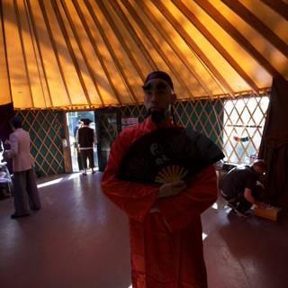 The Red Robe Man in the Yurt at Wickstrom Wedding