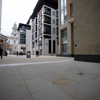Modern Urban Plaza with Historic Church Tower View
