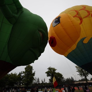 Two Giant Character Balloons Kiss at Hot Air Festival
