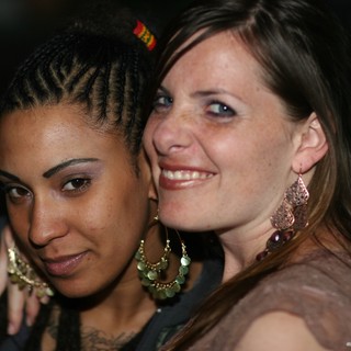 Two Friends Sharing a Joyful Moment at Night