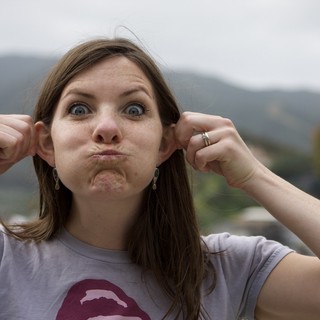 Playful Woman Making Silly Face Outdoors