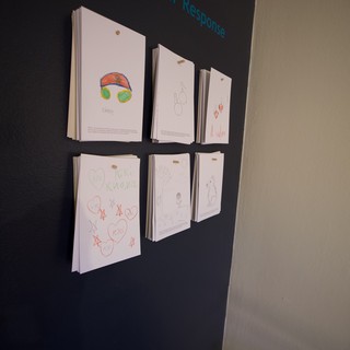 Children's Art Display on Magnetic Chalkboard Wall