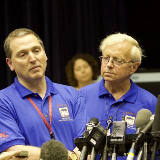Blue-shirted Trio at Phoenix Press Conference