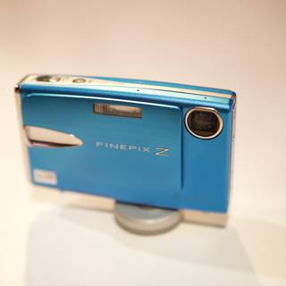 Blue Digital Camera on Table