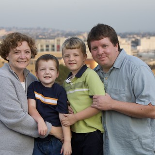 Family Portrait at Sunset on City Rooftop