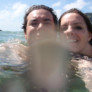 Couple Swimming in Hawaiian Ocean Waters Together