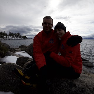 Couple Embracing at Snowy Lake Tahoe Shore