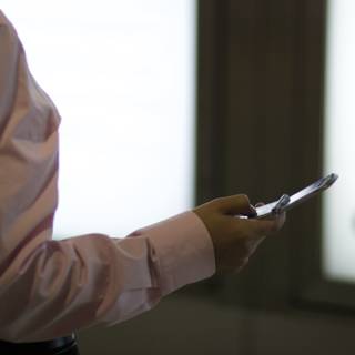 Tech-Savvy Man with a Dress Shirt and Mobile Phone