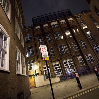 Pedestrian Zone in London Industrial District at Night