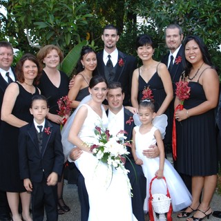 Joyful Wedding Party Celebration in Garden Setting