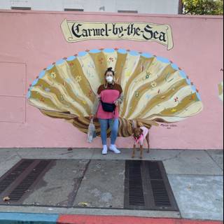 Pink Lady in Front of Seashell Mural