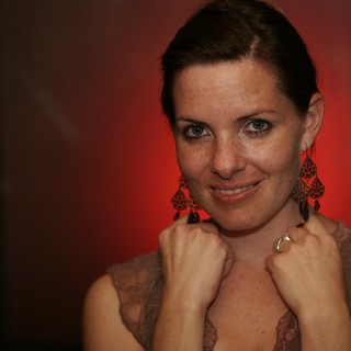 Penelope in Red: Elegant Portrait with Chandelier Earrings