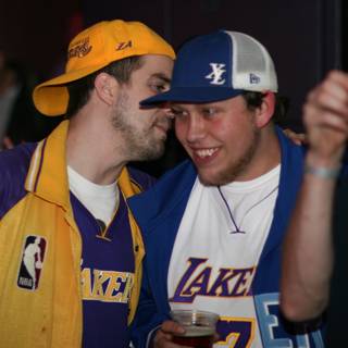Lakers fans celebrate with a beer huddle