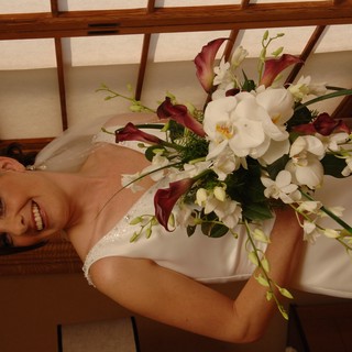 Radiant Bride Holding Elegant Wedding Bouquet Indoors