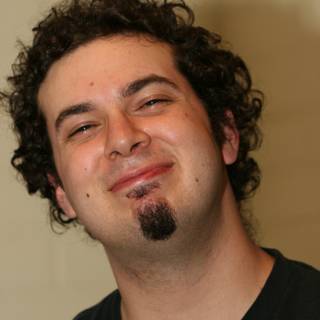 Smiling Man with Curly Hair