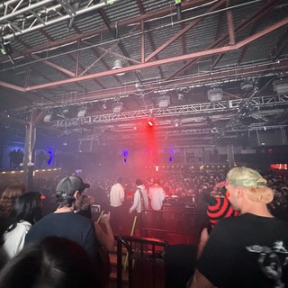 Electronic Music Concert with Fog and Red Lighting