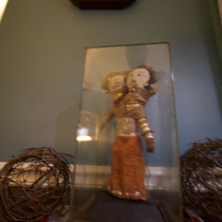 Asian Figurine Display with Decorative Spheres