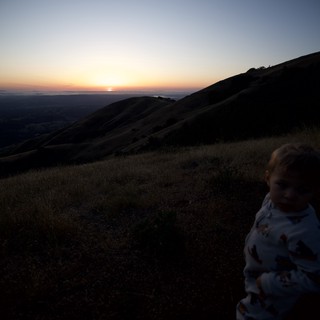 Toddler Watches Sunset from Mount Diablo Summit