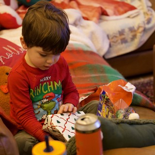 Christmas Morning Joy: Child Opening Presents