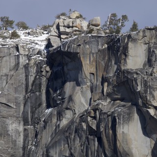 Dramatic Granite Cliff Face with Winter Snow
