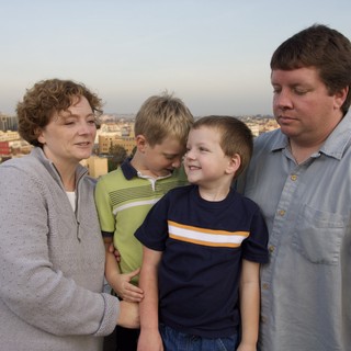 Family Portrait on Urban Rooftop at Dusk