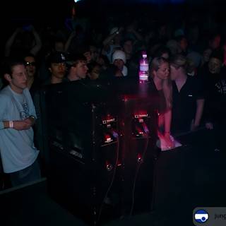 Nightclub Crowd Watching DJ Perform at a Concert