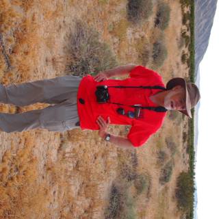 Man with a Hat in a Cloudy Landscape