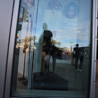 Reflection in Storefront Window at Dusk