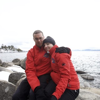 Couple Embracing at Snowy Lake Tahoe Shore