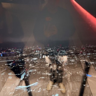Double Exposure: London Skyline Through Indoor Reflection