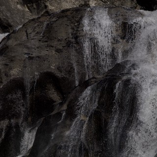 Kayaker Navigating Powerful Winter Waterfall in Yosemite