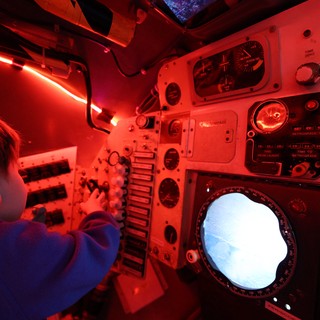Navigator Operating Submarine Periscope Under Red Light