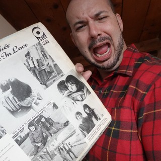 Excited Man Shows Off Vintage Record Album
