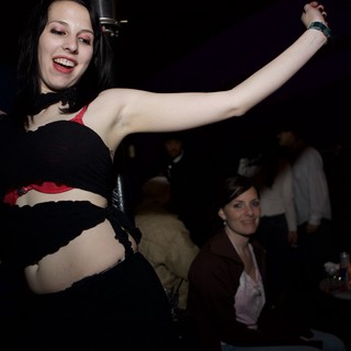 Woman Dancing Freely at Underground Nightclub Event