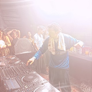 DJ Performance in Hazy Underground Club Atmosphere